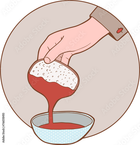 main qui tient une tartine de confiture au dessus d'un bol