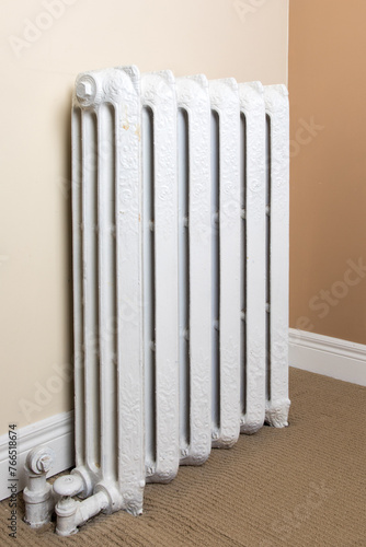 Wallpaper Mural old fashioned steam or hot water heating white painted cast iron radiator in an old residence Torontodigital.ca