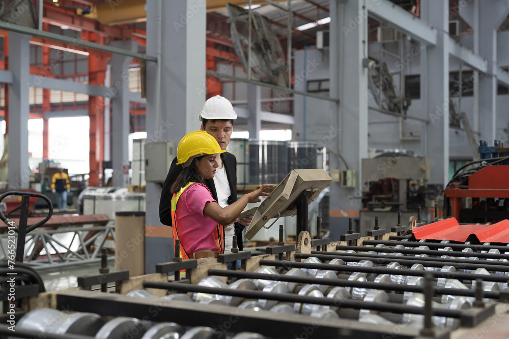 Manufacturing industrial concept. Male and female workers working at manufacturing production lines in factory during manufacturing process Manufacturing industrial concept. Male and female workers working at manufacturing production lines in factory during manufacturing process