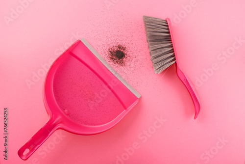 Pink plastic dustpan, brush and black dust