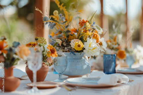 Summer table settings in blue, yellow, terracotta colors. Generative AI photo