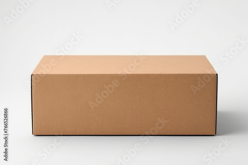 Single empty cardboard box with blank label, on a solid white background, one flap of the lid folded inward, © Khurram