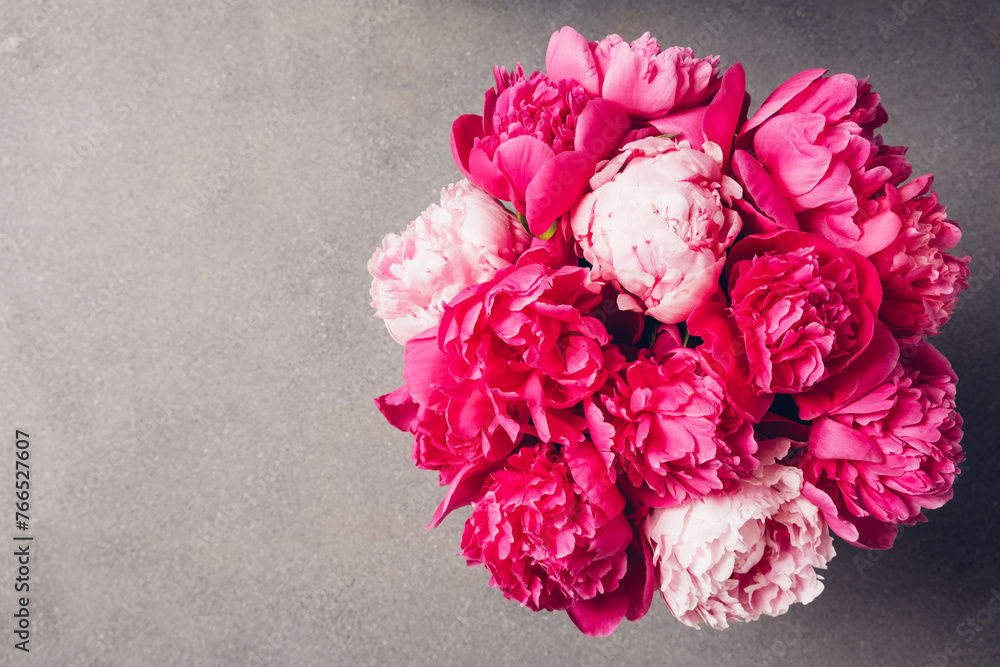Beautiful bouquet of fresh fluffy peony flowers in full bloom, top view. Copy space for text. Beautiful bouquet of fresh fluffy peony flowers in full bloom, top view. Copy space for text.
