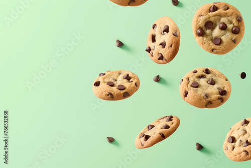 chocolate chip cookies floating in the air, space for copy.