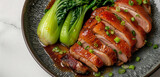 Jinan roasted duck, its crispy, reddish-brown skin beside vibrant green bok choy, on a charcoal gray plate, isolated on white background