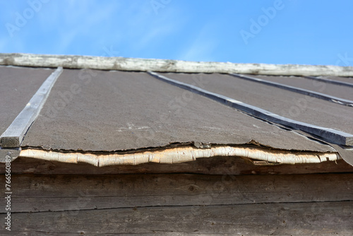 Bild auf Leinwand Birch underlayment under bitumen strips on the roof of a wooden house