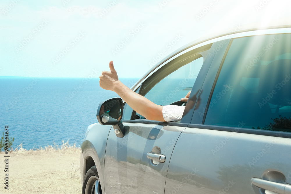 A happy guy in auto sea background