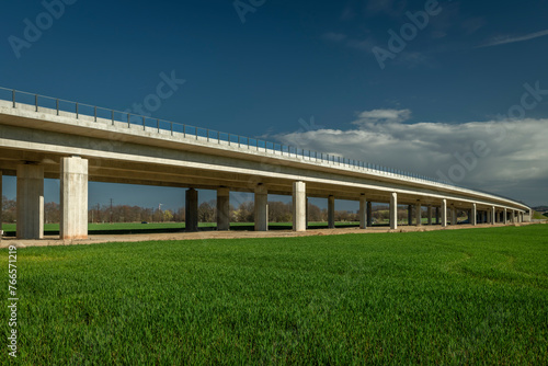 New highway bridge with green field and blue sky near Budweis photo