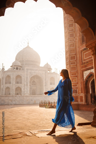 Beautiful woman with blue dress, in the morning at Taj Mahal, India