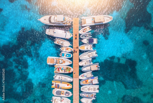 Aerial view of boats and luxure yachts in dock in summer day