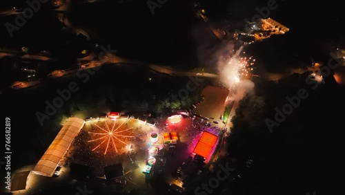 Aerial view of a night party with fireworks