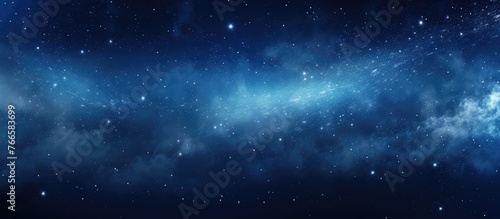 The serene image showcases a vast expanse of a clear blue sky adorned with fluffy clouds and shimmering stars
