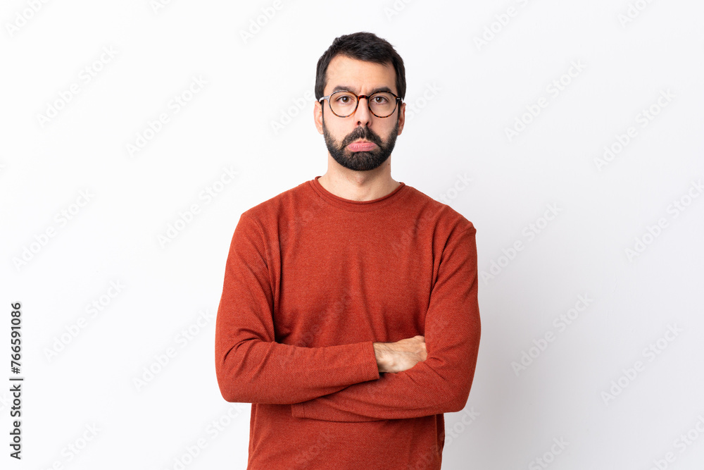 Caucasian handsome man with beard over isolated white background with sad and depressed expression Caucasian handsome man with beard over isolated white background with sad and depressed expression