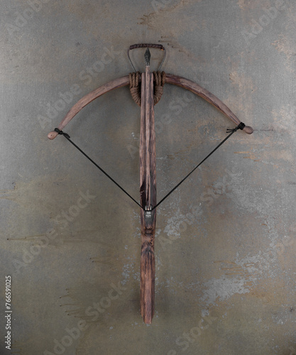 medieval wooden crossbow on a gray background