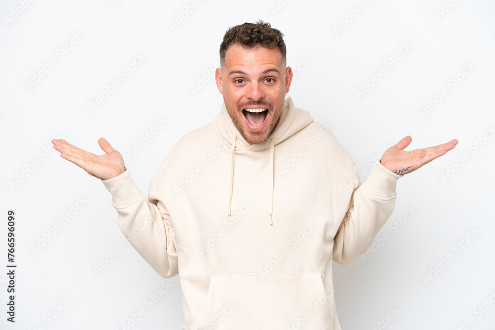 Young caucasian handsome man isolated on white background with shocked facial expression