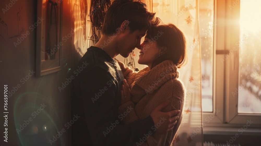 A man and a woman standing in front of a window. Ideal for lifestyle or relationship concepts