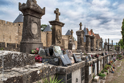 Carcassonne cemetery with its headstones and view of the city walls of Carcassonne in France