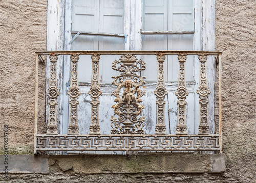 Old sculpted metal railing on a balcony