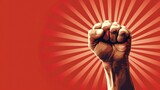 A powerful fist raised in the air on a striking red background. Perfect for activism and protest concepts