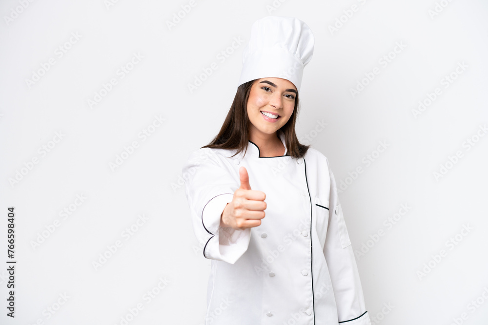 Young Brazilian chef woman isolated on white background with thumbs up because something good has happened Young Brazilian chef woman isolated on white background with thumbs up because something good has happened
