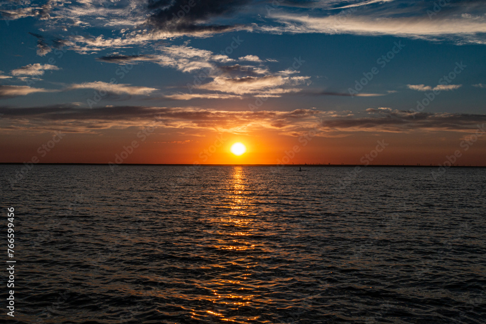 Fototapeta premium Sunset over Lake Newell with contrasting clouds