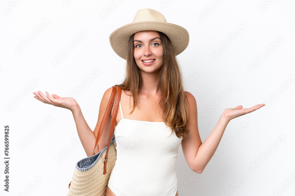 Young caucasian woman in swimsuit in summer holidays isolated on white background with shocked facial expression Young caucasian woman in swimsuit in summer holidays isolated on white background with shocked facial expression