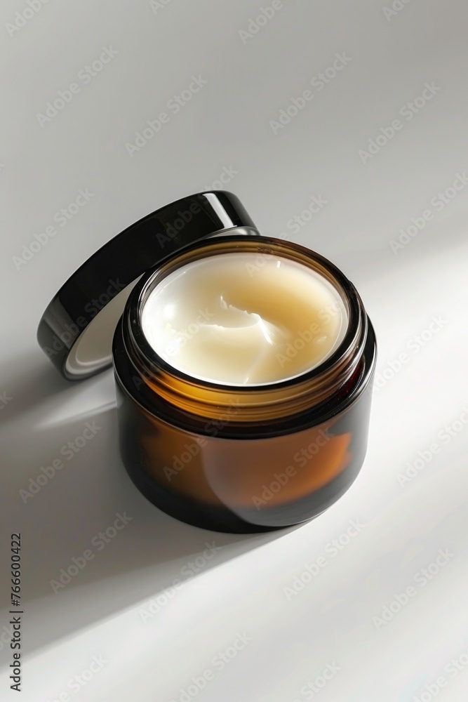 A jar of cream on a table, suitable for beauty or skincare concepts A jar of cream on a table, suitable for beauty or skincare concepts