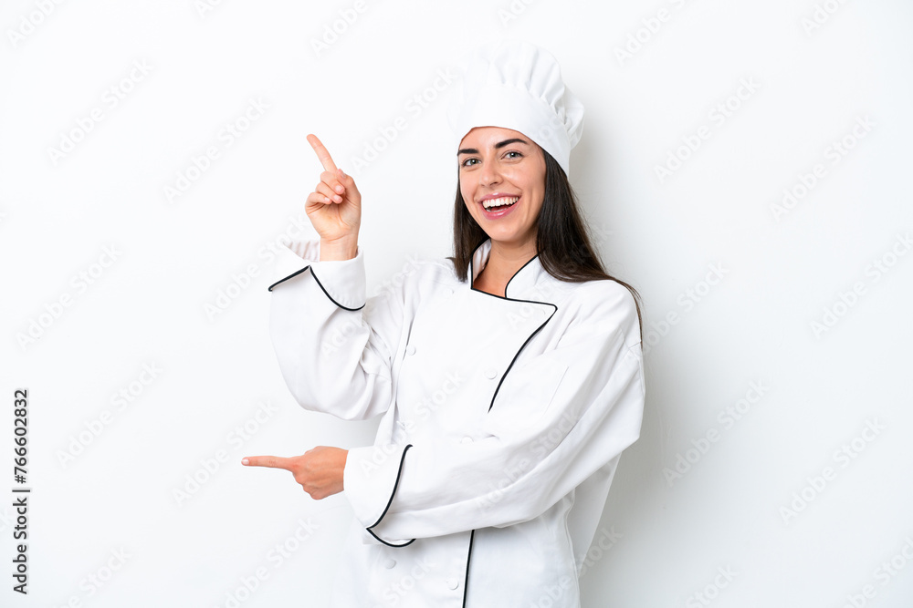 Young chef woman over white background pointing finger to the side and presenting a product Young chef woman over white background pointing finger to the side and presenting a product