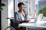 A joyful African American woman in a wheelchair engages in a lively phone conversation at home, embodying independence and connectivity.

