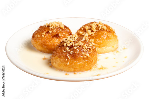 Kemalpasa dessert isolated on white background. Milky dessert. Dessert with hazelnuts, milk and sherbet. Close up photo