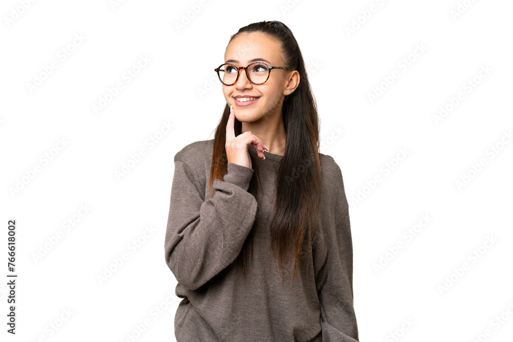 Young Arabian woman over isolated chroma key background thinking an idea while looking up
