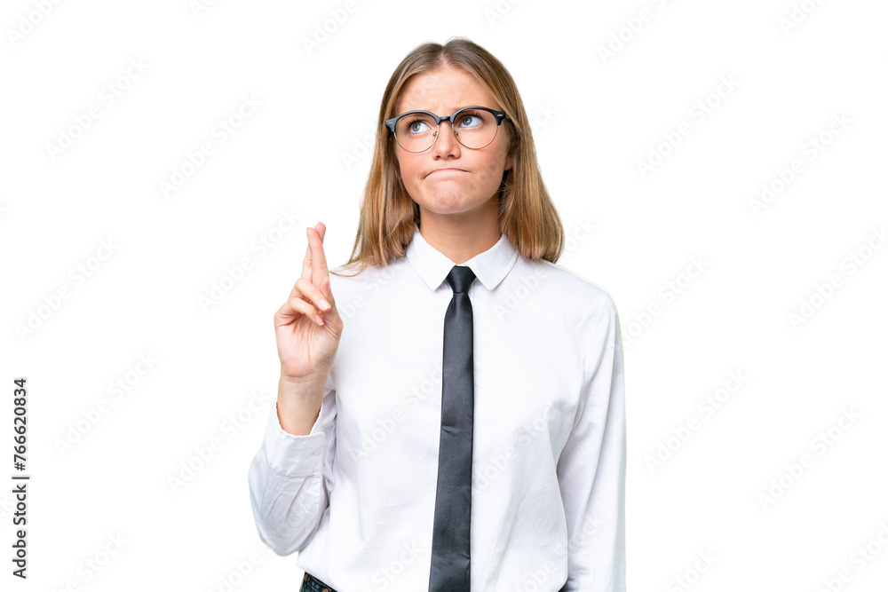 Young business caucasian woman over isolated background with fingers crossing and wishing the best Young business caucasian woman over isolated background with fingers crossing and wishing the best