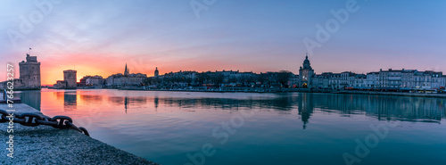 beautiful illuminated cityscape of the old harbor of La Rochelle photo