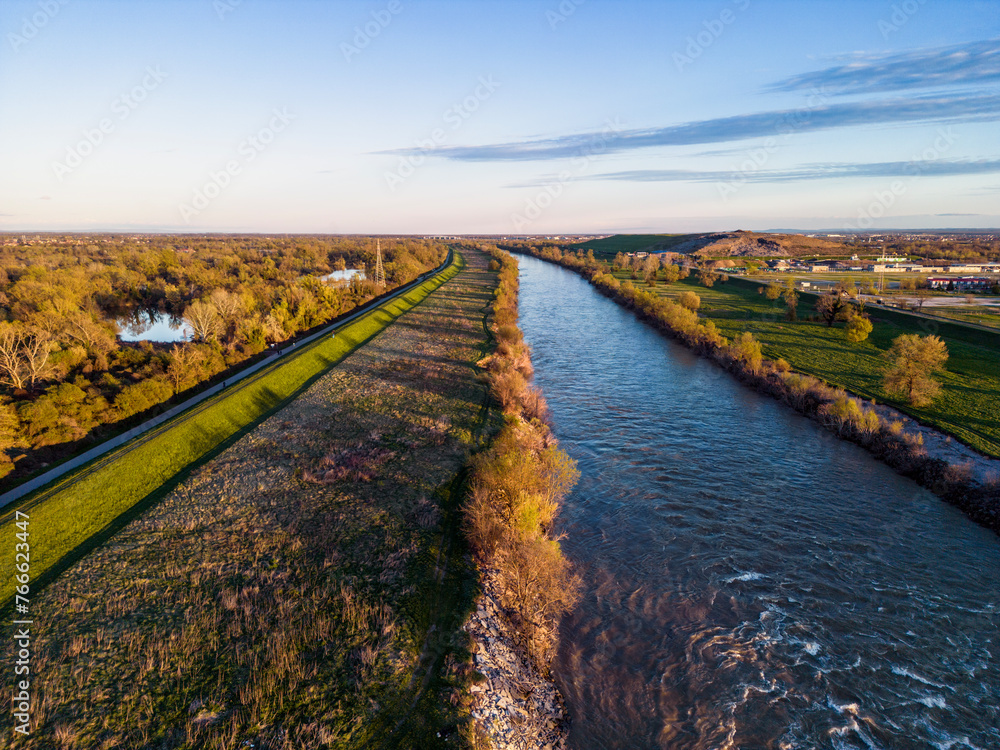 Beautiful landscape of Sava river embankment on the eastern part of Zagreb city, Croatia, photographed with drone at sunset
