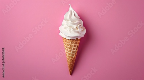 The image shows a white meringue ice cream cone placed in the center of a pink background. The photo photo