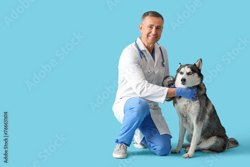 Male veterinarian with cute...