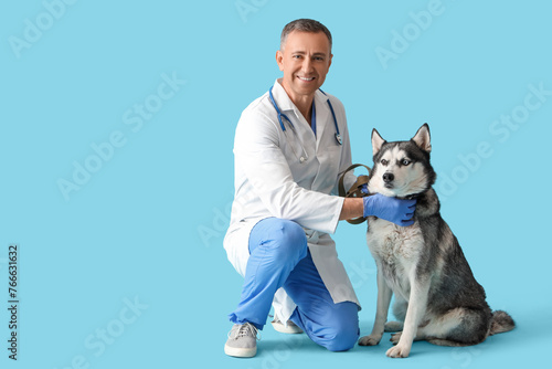 Male veterinarian with cute...