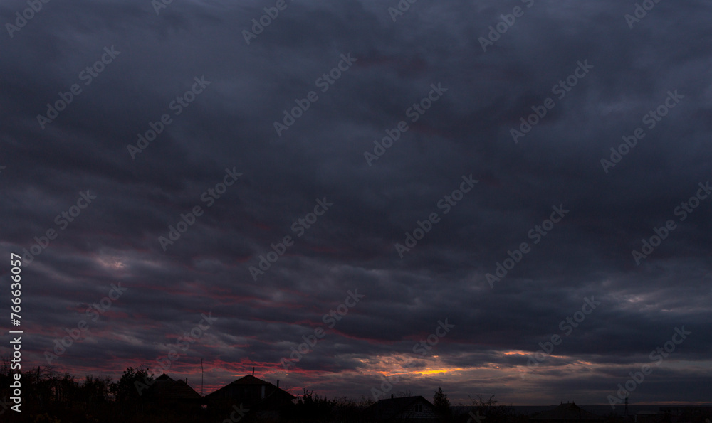 Landscape at sunset. Tragic gloomy sky. Panorama. Crimson twilight. Landscape at sunset. Tragic gloomy sky. Panorama. Crimson twilight.