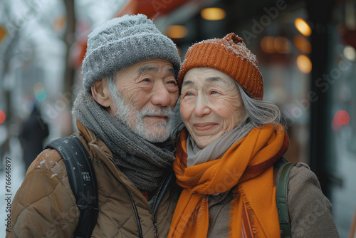 Senior elderly loving Asian couple very old man and old woman hugging walking. Faces covered wrinkles © Алина Троева