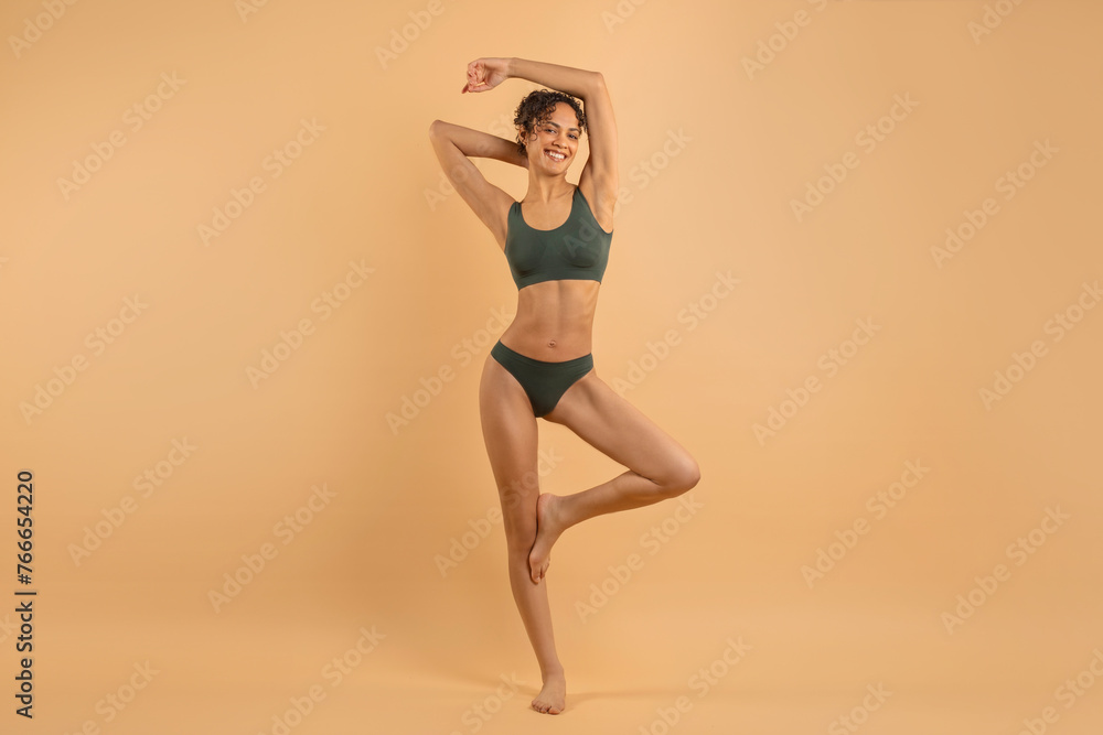 Body sculpting. Slim woman in underwear standing with hands raised up, full length shot of beautiful woman with perfect figure, copy space - obrazy, fototapety, plakaty 