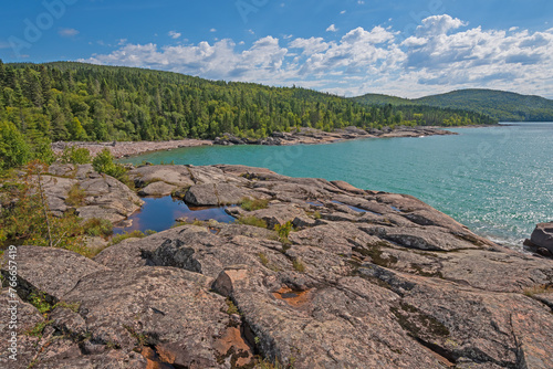 Torquoise Waters on a Forested, Rocky Inlet