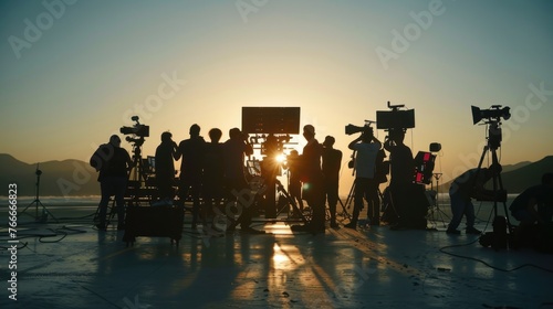 Silhouette of crew and team shooting production in studio