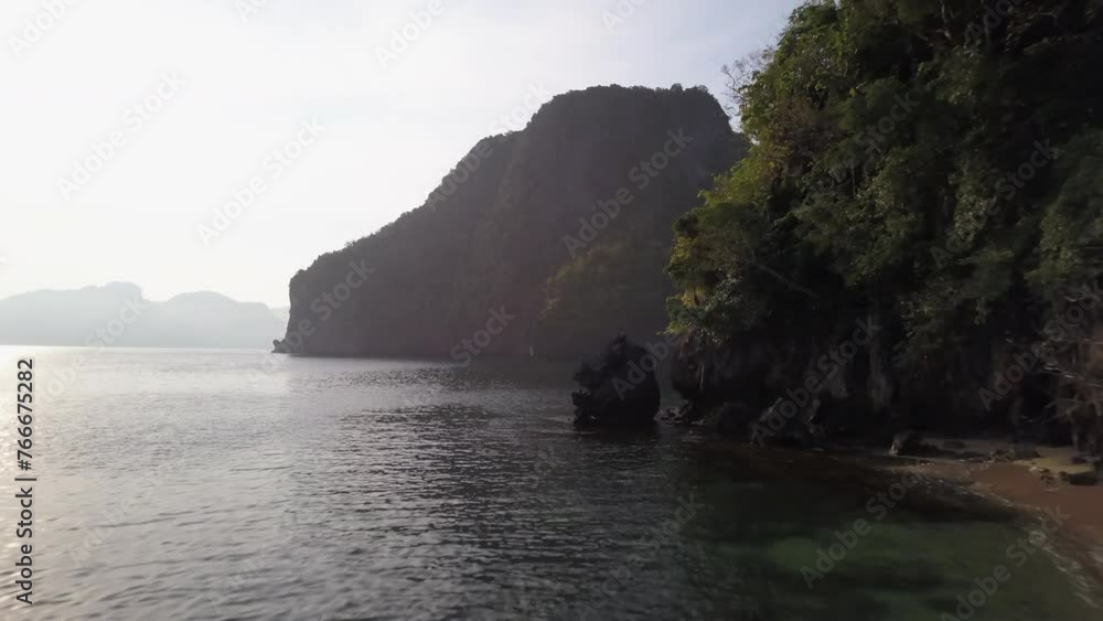 Aerial: Drone Forward Scenic View Of Outrigger Moored At Sea Coastline Against Clear Sky - Palawan, Philippines Aerial: Drone Forward Scenic View Of Outrigger Moored At Sea Coastline Against Clear Sky - Palawan, Philippines