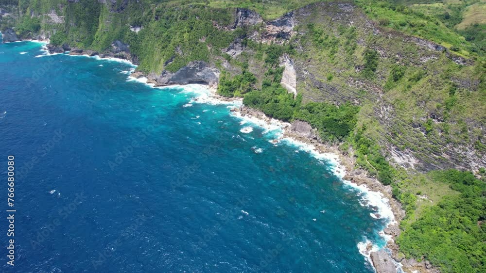 Forward reveal aerial shot of South Shore in Guyangan Waterfall area on sunny day. Nusa Penida Island, Indonesia. Forward reveal aerial shot of South Shore in Guyangan Waterfall area on sunny day. Nusa Penida Island, Indonesia.