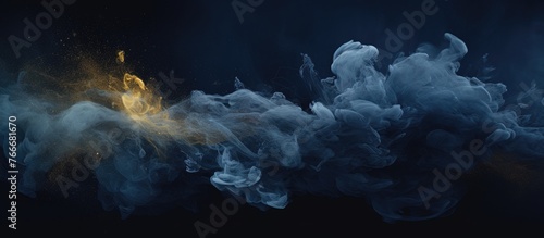 Thick billowing smoke is illuminated by a vibrant yellow light in a mesmerizing display