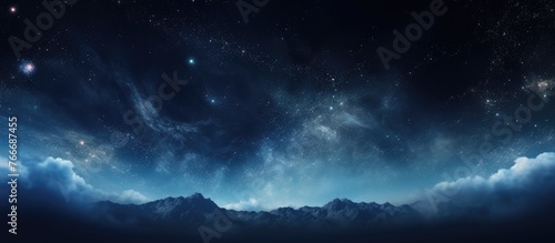 View of majestic mountains stretching into the distance under a blanket of sparkling stars in the night sky