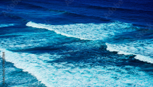Fototapeta Naklejka Na Ścianę i Meble -  White sea waves rolling in to the Caribbean shore in Old San Juan, Puerto Rico