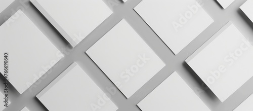 Blank brochures placed on a gray background, viewed from above. Mock-up for designing purposes.