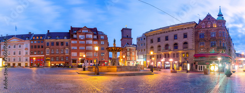 The oldest square Gammeltorv or Old Market with Caritas Fountain at night, Copenhagen, Denmark