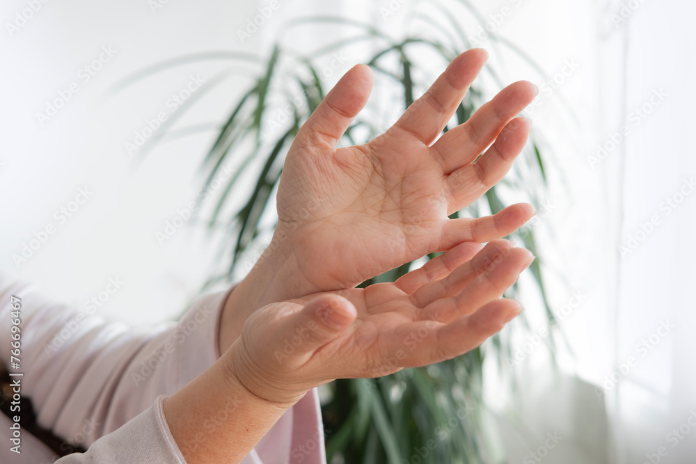 close-up hands elderly woman on light background, Aging and beauty, graceful wrinkles, anti-aging cosmetology and care for aging skin close-up hands elderly woman on light background, Aging and beauty, graceful wrinkles, anti-aging cosmetology and care for aging skin
